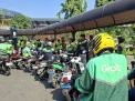 Ratusan Pengemudi Ojol Gelar Aksi di Monas, Desak Potongan Komisi 8 Persen Berlaku untuk Seluruh Layanan